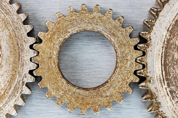 Metal gears showing corrosion on their surfaces