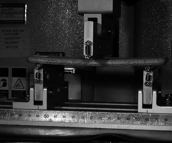 Close-up of a carbon-fibre composite structure and its mechanical connections